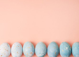 Colorful easter eggs on orange  background