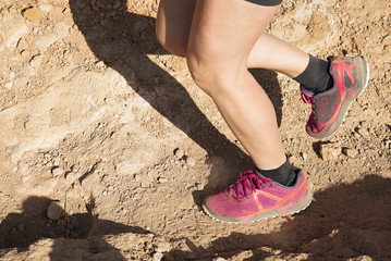 Trail running workout on rocky terrain outdoors.View from above