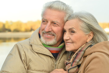 senior couple near river