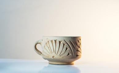 hademade clay cup isolated on white background