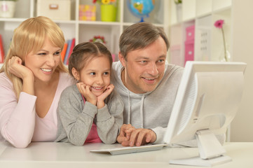 happy family playing  on computer