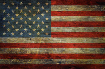 Fototapeta na wymiar American flag on grunge wooden background