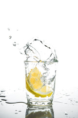 Lemon with water splash and drops