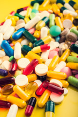 Closeup of colored pills and capsule