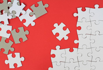 Puzzle pieces on red background