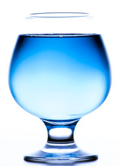 glass with light blue water on white background