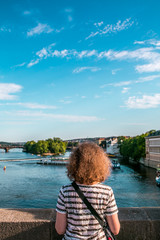 Fototapeta premium People on the bridge in Prague looking at the landscape