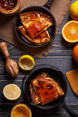 Homemade french crepes with orange syrup.