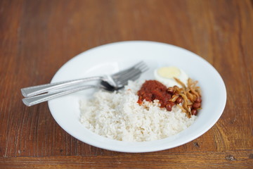 Nasi Lemak or Malay fragrant rice, xooked in coconut milk and pandan leaf