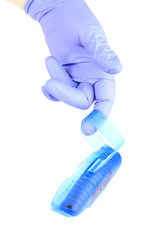 One hand in rubber glove with toilet bowl cleaner