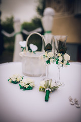 Wedding accessories decorated with various flowers and feathers Peacock