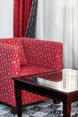 Detail of red armchair in the vintage interior
