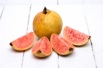 Fresh guava fruits on a white background.