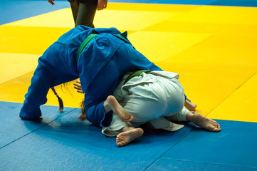 Girls compete in Judo.