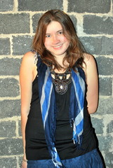 Female beauty fashion model posing in a studio basement.