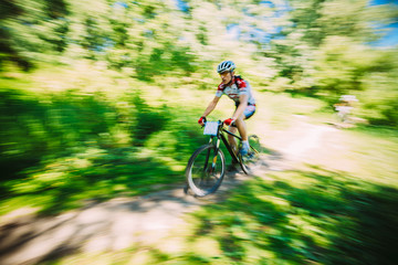 Naklejka premium Abstract motions blur background of mountain Bike cyclist riding