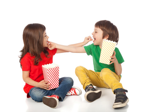 Children eating popcorn
