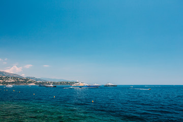 Modern Yacht in Bay In Sunny Summer Day. Vacation on sea