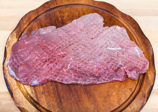 top view of beaten piece of meat