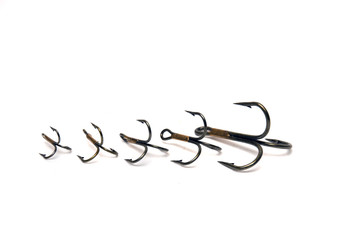 Treble fish hooks isolated on a white background.