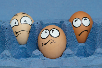 Three frightened egg face  waiting cooking