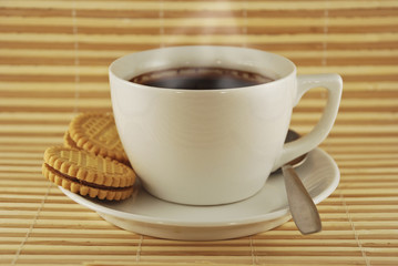 Cup of coffee with cookies