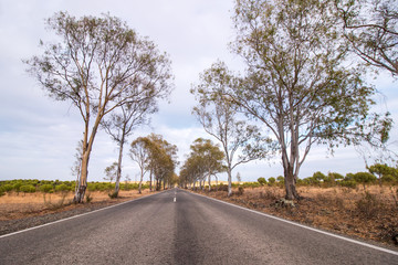 Long asphalt road on the beautiful countryside.