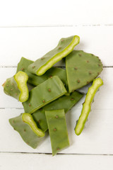 Sliced opuntia ficus-indica cactus leaf on a white background