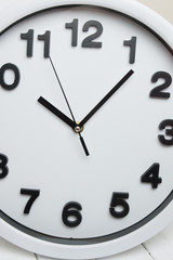 White kitchen clock with black numbers