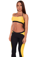 Fototapeta premium Fitness woman in sport style standing against isolated white background