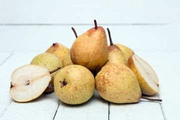 Fresh tasty yellow pear fruits isolated on a white background.