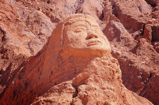 Face silhouette in the cliff near Pre-Cloumbian ruins Pukara de Quitor. San Pedro de Atacama. Chile.