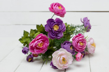 Fake bouquet of flowers isolated on a white background.