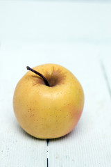 Fresh tasty yellow apple fruit isolated on a white background.