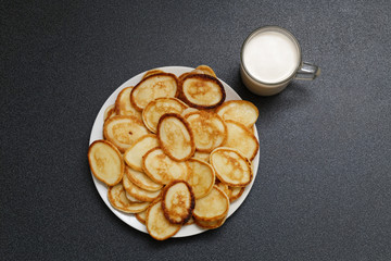Plate of pancakes and a cup of milk