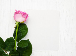 Pink rose with card