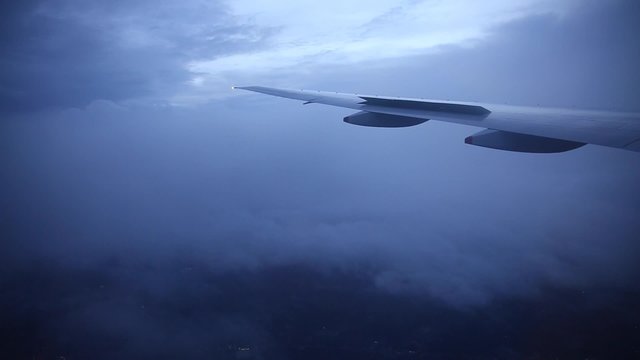 Traveling by air. View through an airplane window while the storm and shake.