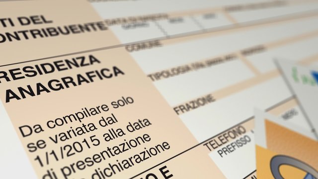 camera panning on a 730 italian tax form with euro banknotes
