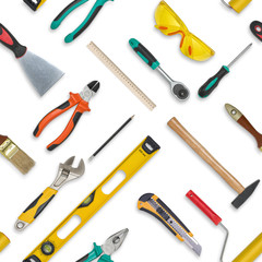 Set of construction tools isolated on a white background. Level,, glasses, wrench, spanner, paint roll, hammer, cutter, pliers. Seamless texture background