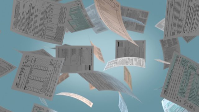 several Usa tax forms falling from above