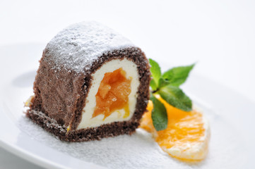 cream cake with orange jam in on white plate, product photography for patisserie or shop
