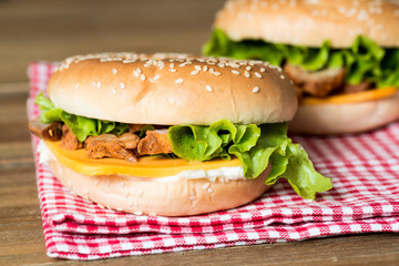 Bagel with fresh cheese and fresh lettuce on napkin