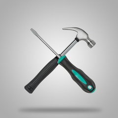 Crossed wrench and hammer on gray background like icon