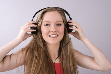 Fototapeta premium Teenager with headphones listening to music