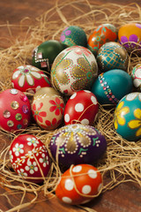 Fototapeta na wymiar Colorful easter eggs on wooden board