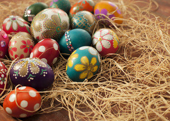 Fototapeta na wymiar Colorful easter eggs on wooden board