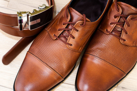 A pair of luxurious men's leather shoes.