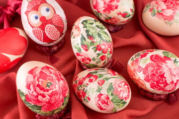 Decorated Easter eggs on red silk