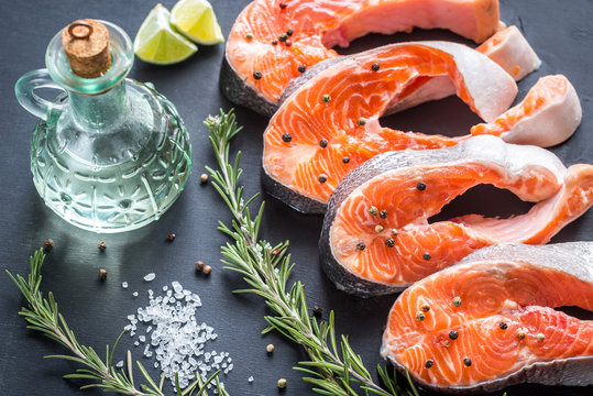 Raw trout steaks on the wooden board