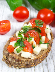 Ciabatta bread with tomatoes, mozzarella and basil.